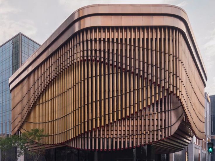 a large building with wooden slats on it's side and the words insider above it