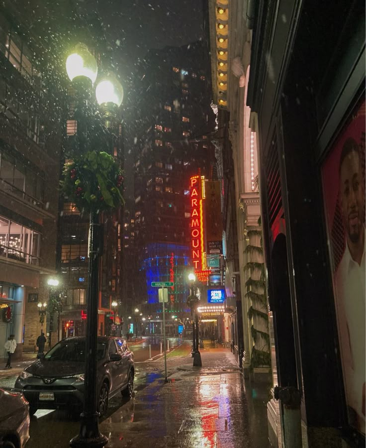 a city street at night in the rain