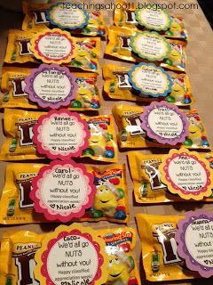 some candy bags are lined up on a table with the names of each item in them