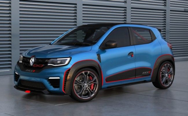 a blue car parked in front of a garage door