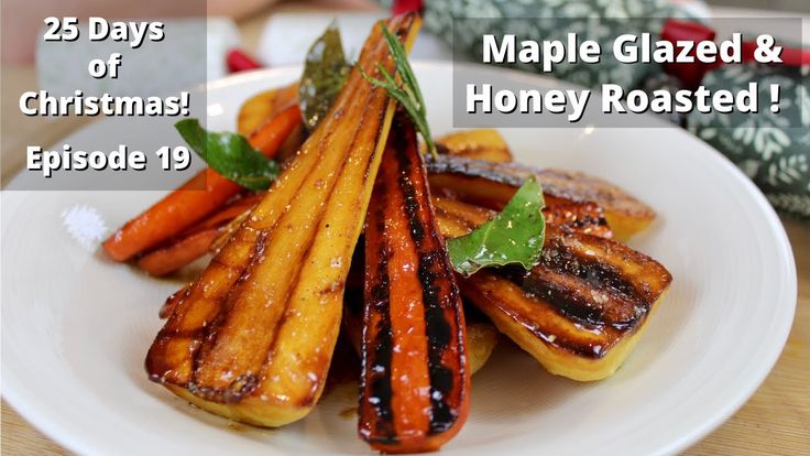 a white plate topped with sliced up carrots and other food on top of a wooden table