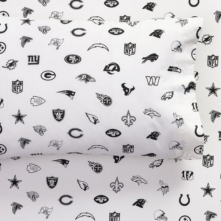 two pillow cases with black and white nfl logos on them