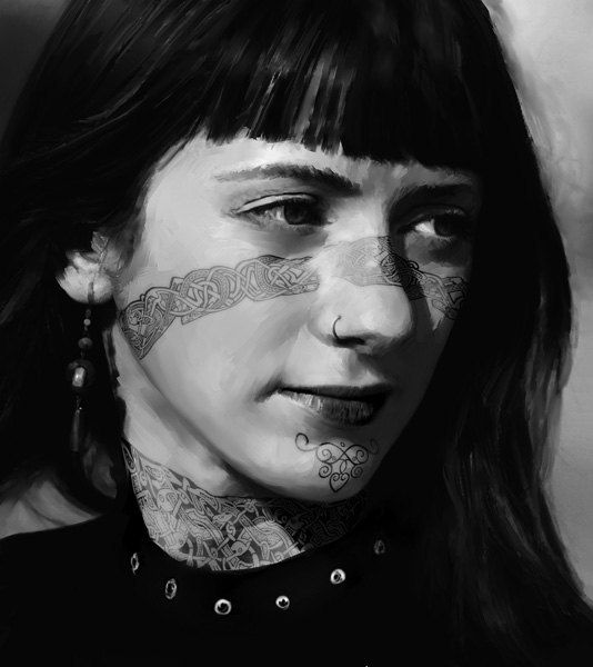 a woman with tattoos on her face and neck