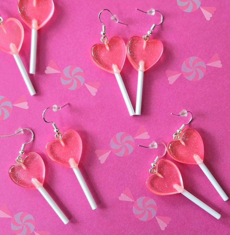 𝒜 𝓈𝓌𝑒𝑒𝓉 𝓉𝓇𝑒𝒶𝓉 𝒿𝓊𝓈𝓉 𝒻𝑜𝓇 𝓎𝑜𝓊. ♥  Sweeten your style with these heart-shaped lollipop earrings. Featuring charms of pastel pink resin with a touch of glitter, these lightweight dangly earrings offer a playful pop of color and charm. Size: 4.8 cm x 1.8 cm Sweet Pink Heart Dangle Earrings, Sweet Pink Dangle Heart Earrings, Playful Pink Earrings For Valentine's Day, Sweet Pink Heart-shaped Earrings, Cute Pink Heart Earrings For Birthday, Sweet Pink Party Earrings, Playful Pink Heart Earrings For Valentine's Day, Playful Pink Heart Earrings For Gift, Playful Pink Heart Earrings As Gift