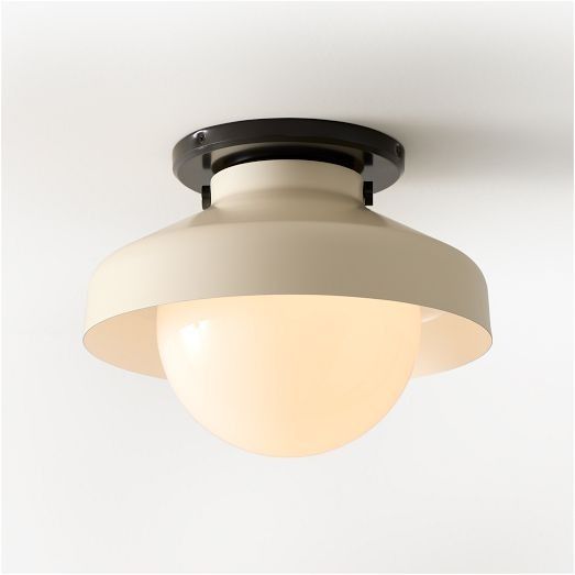 a white light hanging from the ceiling with a black frame and an oval glass shade