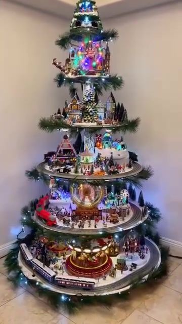 a christmas tree made out of legos and other toys in a room with white walls