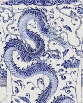 a blue and white vase with a dragon on it