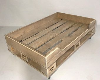 a wooden crate sitting on top of a white table