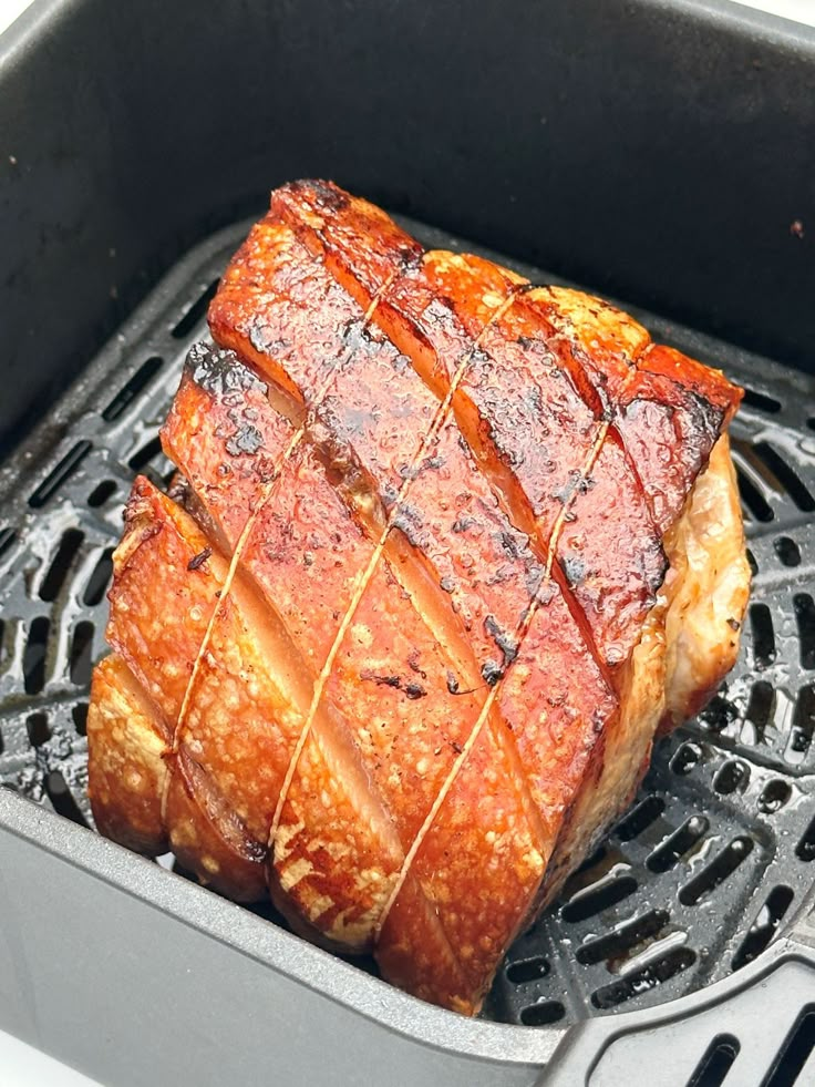 a large piece of meat on top of a grill