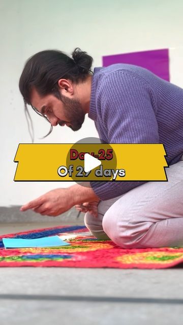 a man kneeling on the ground looking at a piece of paper with words above it