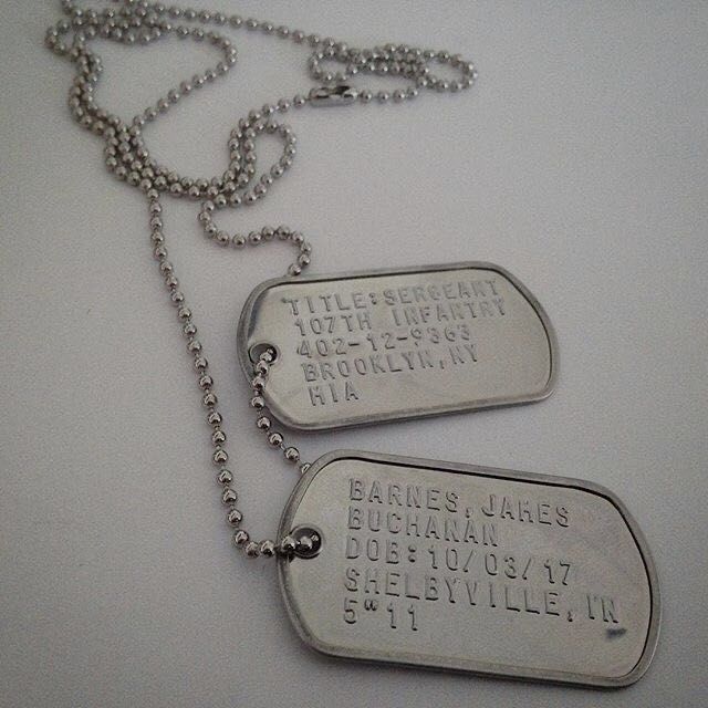 two dog tags are attached to a chain