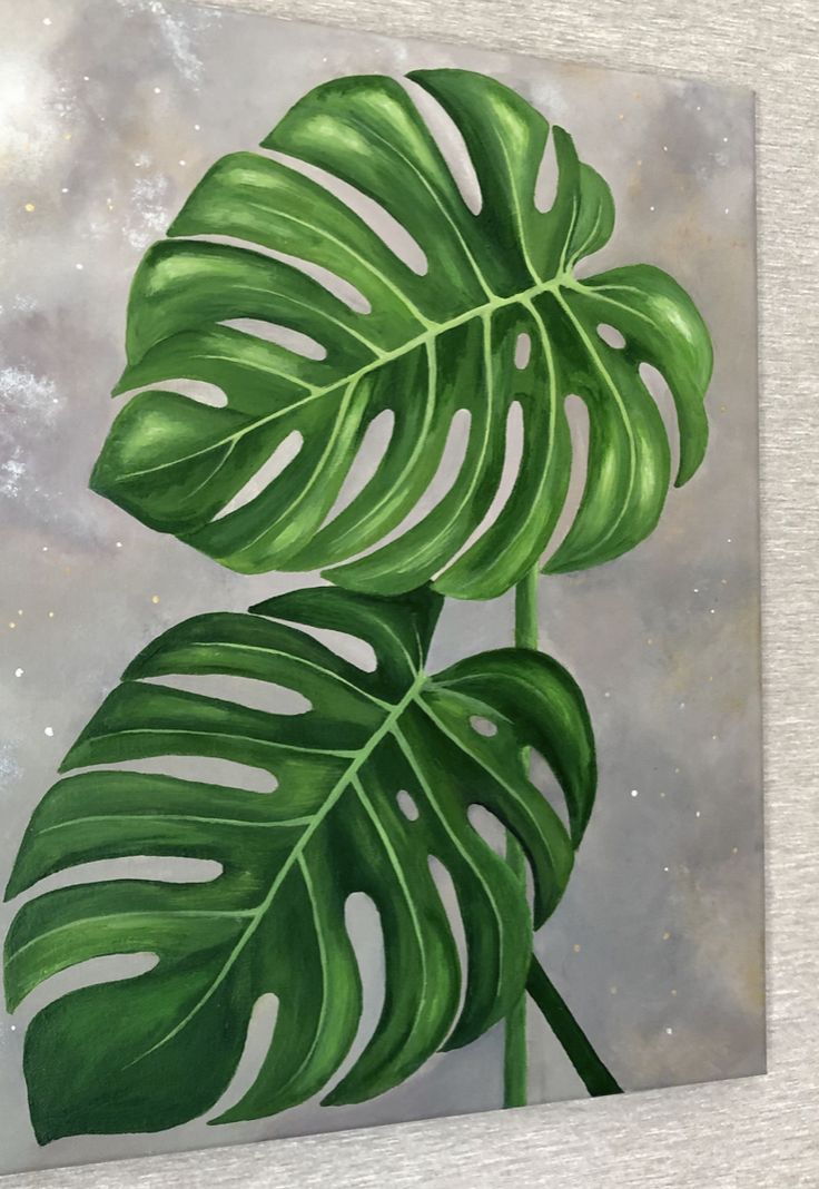 a painting of a large green leaf