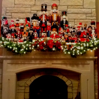 a fireplace decorated with christmas decorations and nutcrackers