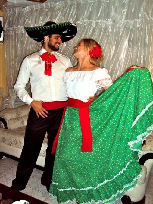 a man and woman dressed in mexican attire