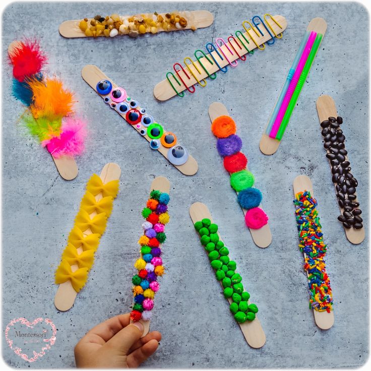 popsicle crafts with different types of beads and pencils