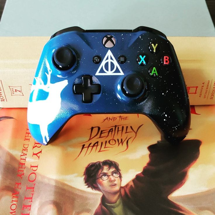 a harry potter video game controller sitting on top of a package