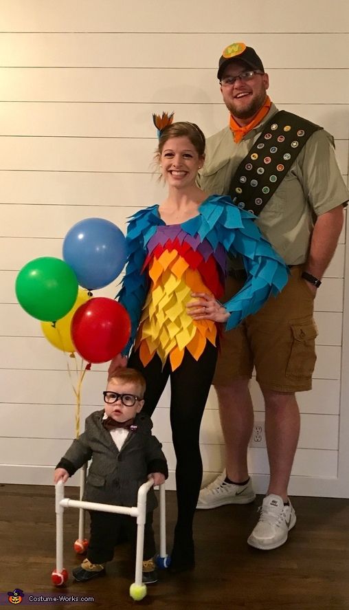 a man, woman and child dressed up in costumes