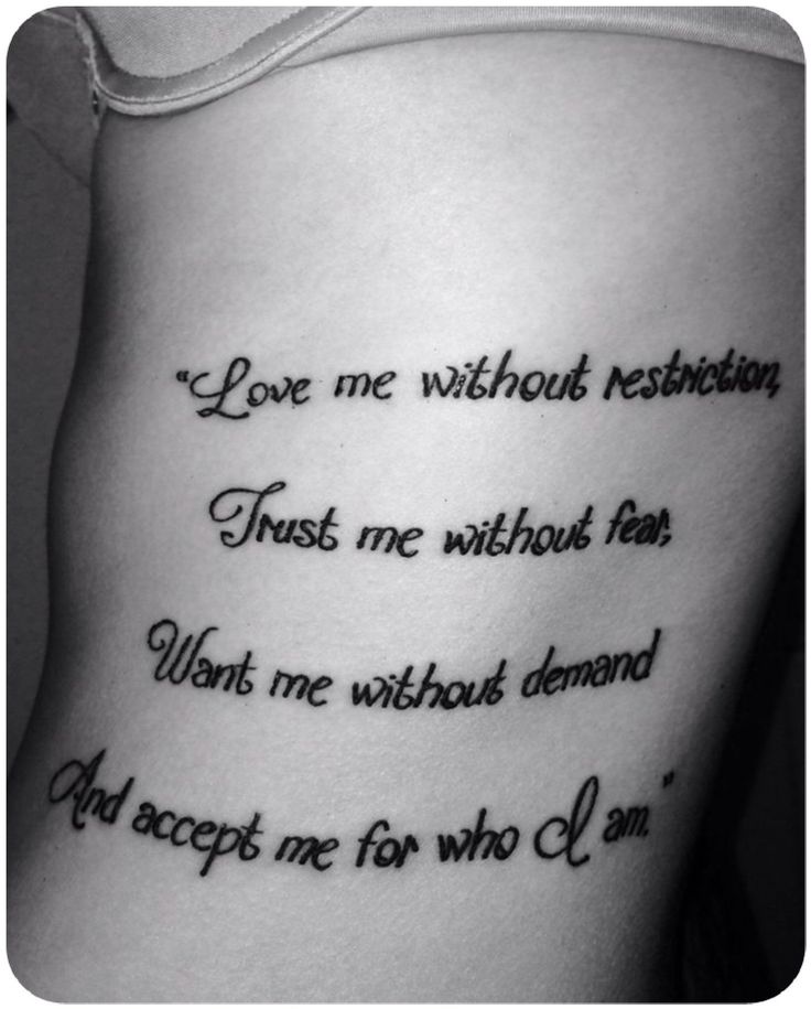 the back of a woman's stomach with words written in cursive writing