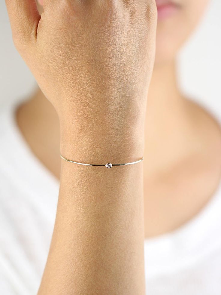 JSVConcepts Fine Jewelry Diamond Bangle Bracelet, Diamond Solitaire Bangle Bracelet, Minimalist Bracelet, 14K Gold Bangle Bracelet, Diamond Bracelet, Gift for her ≫ Product Details ◈ Handmade / Handcrafted Fine Jewelry ◈ Diamond: 100% Natural Diamond ◈ Diamond Weight: 0.07 ct. (2.60 mm) ◈ Color: G Color ◈ Clarity: VS-SI ◈ Cut: Brilliant Cut ◈ Bangle Thickness: 1.30 mm ◈ Metal: Solid 14K Gold (18K also available - Additional fees may apply) ◈ Gold Color: White gold, Rose gold, Yellow gold ≫ Pleas Adjustable Dainty Diamond Bangle Bracelet, Dainty Adjustable Diamond Bangle Bracelet, Minimalist Rose Gold Sterling Silver Bracelet, 14k Gold Adjustable Bracelet, Minimalist Stackable White Gold Diamond Bracelet, Adjustable 14k Gold Bracelet With Simple Design, Minimalist White Gold Stackable Diamond Bracelet, Minimalist Stackable White Gold Bracelets, Minimalist White Gold Stackable Bracelets