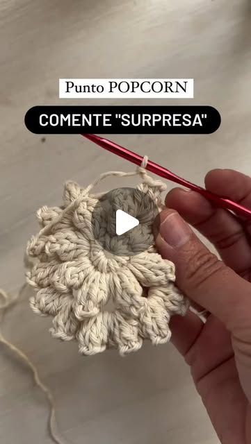 the video shows how to crochet an object with yarn and cotton, as it is being worked on