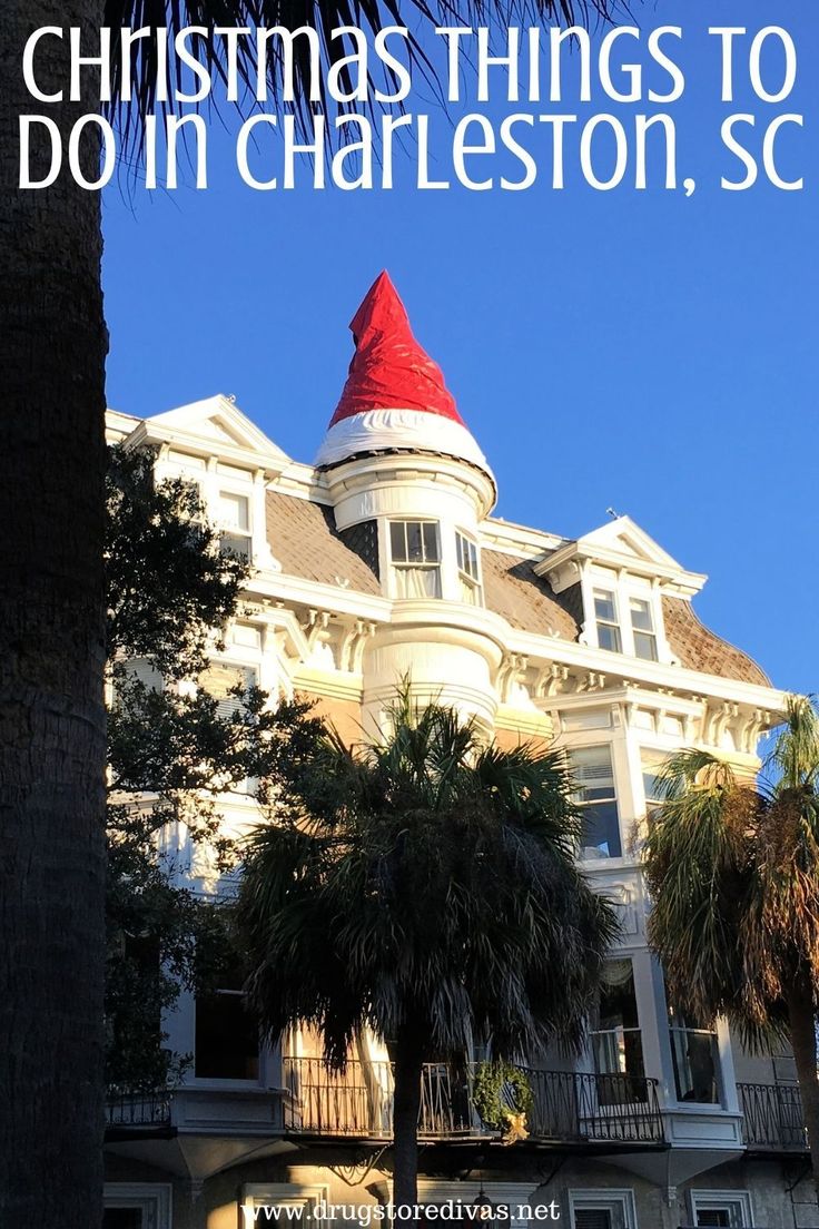 a large white house with a santa hat on it's roof and palm trees