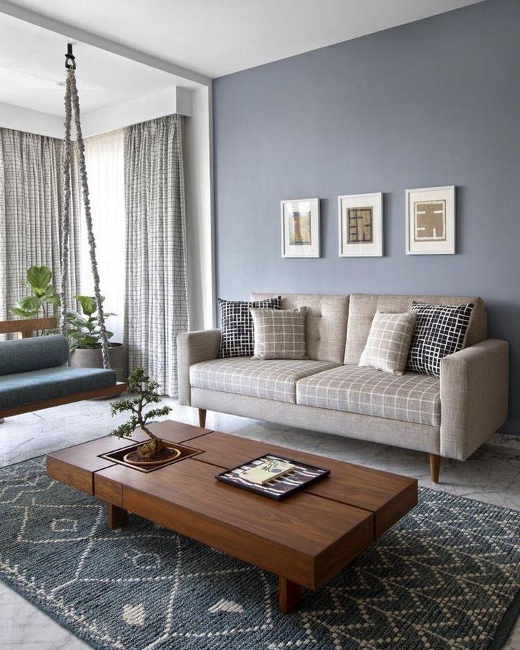 a living room with blue walls and furniture