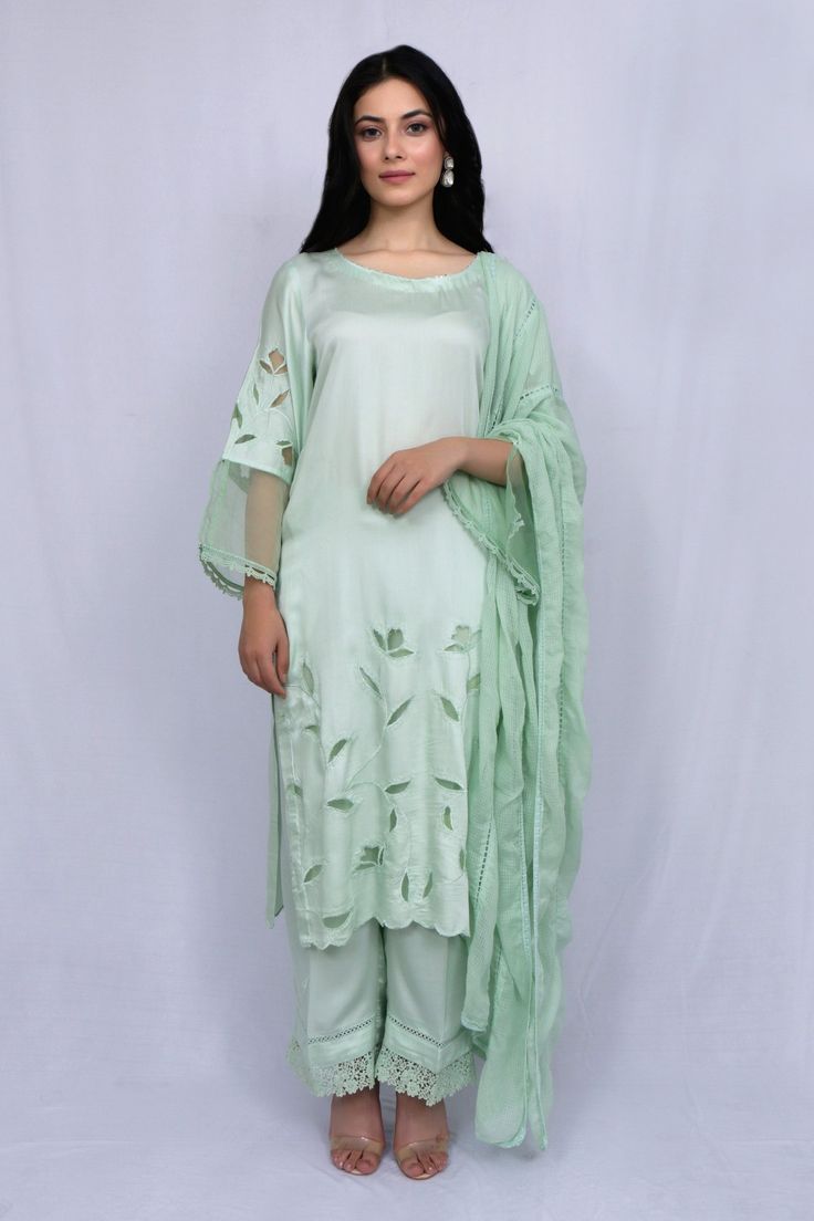 Mint green kurta with floral cutwork and sheer sleeve hem detailing. Paired with tonal pant and kota dupatta.
Component: 3
Type Of Work: Floral
Neckline: Round
Sleeve Type: Full sleeves
Fabric: Modal Satin, Kota, Organza
Color: Green
Other Details: 
Sheer sleeve hem
Nalki work or neckline
Scallop hem on kurta
Occasion: Puja - Aza Fashions Floral Cutwork, Kurta Set For Women, Scallop Hem, Fashion App, Kurta Set, Full Sleeves, Scalloped Hem, Cut Work, Sheer Sleeves