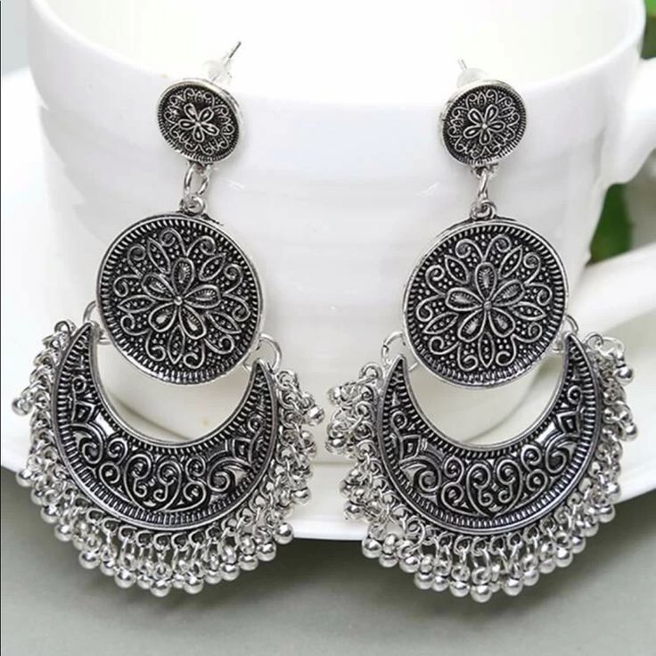 Bead Tassel Drop Chandbali Jhumka Earrings Material - Metallic With Good Quality Color - Silver Style - Dangle Details - Round Eardrop Height - 2.8” Eardrop Width - 1.4” Care Instruction : Avoid Heat & Chemicals Like Perfume, Deo, Alcohol Etc. Clean With Dry Cotton Cloth. Pack In Air Tight Container After Use. Silver Bohemian Tassel Earrings With Dangling Beads, Silver Bohemian Chandelier Earrings With Tassels, Festival Tassel Earrings, Traditional Tassel Dangle Earrings For Festivals, Bohemian Round Chandelier Earrings With Latkans, Silver Tassel Earrings For Festivals, Silver Bohemian Tassel Earrings, Traditional Tassel Chandelier Earrings For Festival, Silver Bohemian Tassel Earrings For Festival