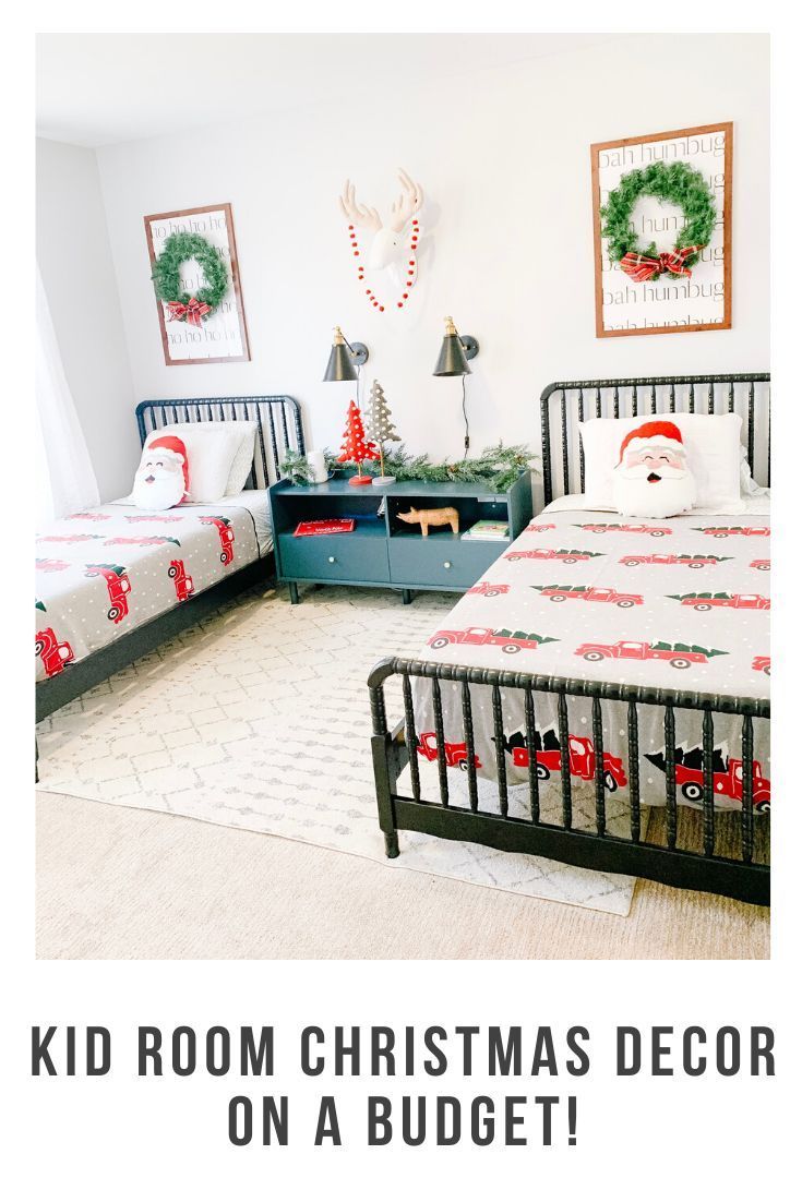 two beds in a room decorated for christmas