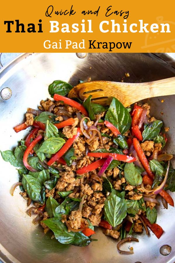 thai basil chicken with red peppers and spinach in a wok