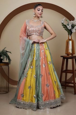 Multicolor attached cancan lehenga featuring panel detailing with zari and mirror hand embroidery. Paired with a mirror hand embroidered padded blouse with a shaded dupatta. - Aza Fashions Fusion Style Choli For Diwali With Traditional Drape, Sleeveless Multicolor Lehenga For Wedding, Multicolor Sleeveless Choli With Dupatta, Fusion Multicolor Designer Wear Sets, Festive Fusion Sets With Resham Embroidery, Multicolor Embroidery Lehenga With Gota Work, Fusion Style Festive Choli With Traditional Drape, Fusion Style Multicolor Sets For Navratri, Fusion Style Multicolor Designer Sets