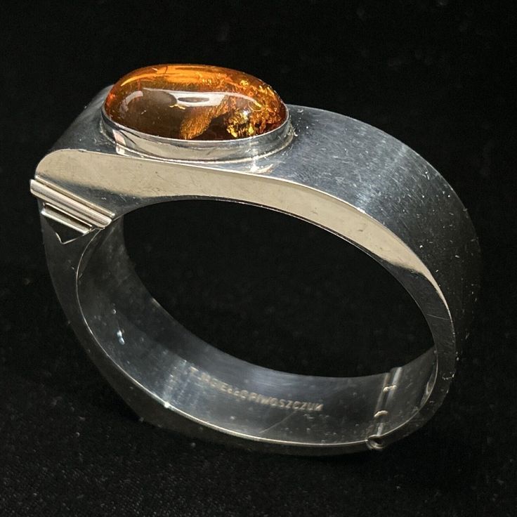 Tomasz Jagiello-Piwoszczuk Sterling Silver Amber Bracelet Poland Modernist Click the link to purchase💰⬇️ #brutalist #bracelet #cuff #modernist #jewelry #vintage #affiliate #ad Designer Round Jubilee Bracelet Jewelry, Modernist Hallmarked Oval Jewelry, Modern Polished Sterling Silver Bracelet, Designer Oval Hallmarked Jewelry, Designer Hallmarked Jewelry For Collectors, Designer Oval Jewelry Gift, Designer Oval Jewelry For Gift, Luxury Collectible Round Bangle, Designer Oval Silver Jewelry