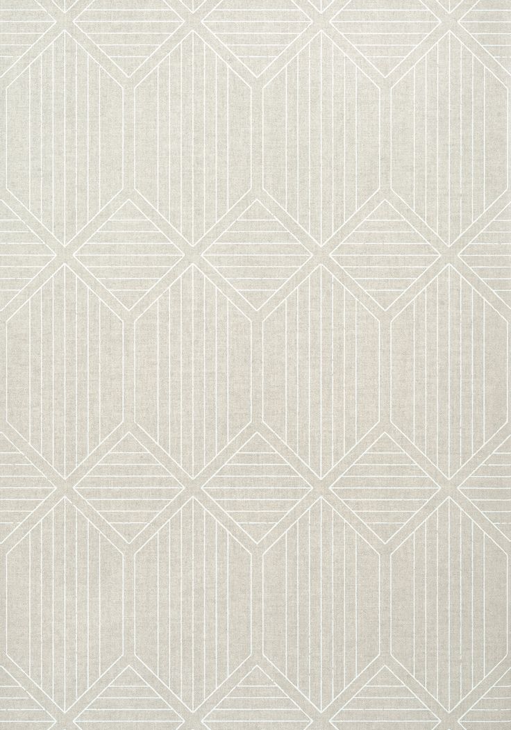 a white rug with an abstract design on the front and back side, in shades of beige