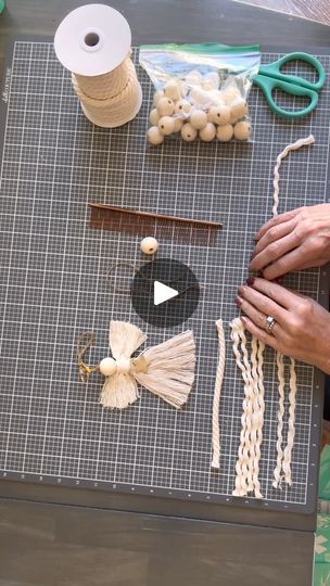 the woman is working on her craft with yarn, scissors and other things to make it