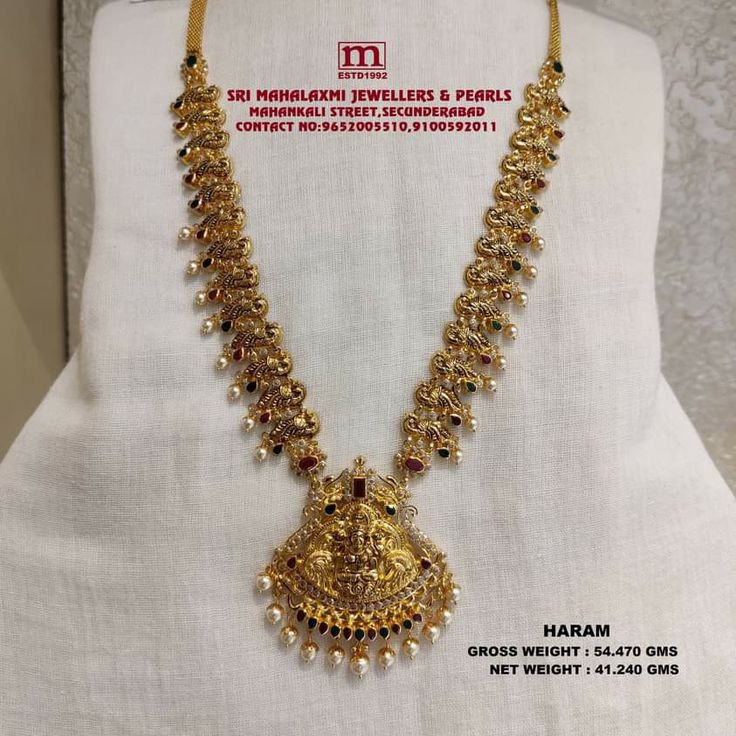 Presenting Here Very Light Weight New Collection Added Antique Finish Long Harams In The Stock Studded with Ruby and emeralds and cz's and South Sea pearls. VISIT OUR SHOWROOM FOR FULL RANGE OF COLLECTION AT WHOLESALE PRICES Please call WHATSAPP VIDEO CALL NO. 9100592011, 9652005510 www.srimahalaxmijewellers.in #SriMahalaxmiJewellers #MahalaxmiJewellers #longharam #haram #tradional #tradionalwear #southindian #southindianwear #bridalwear #partywear #briderjewellery Long Haram In 100 Grams, Gold Mini Haram In 30grams, Long Harams Under 40 Grams, 50grams Gold Haram Long, Long Haram Gold Jewellery Designs With Weight, Light Weight Haram Designs Gold, Deepika Jewellery, 40grams Gold Haram Latest, Gold Long Necklace With Grams