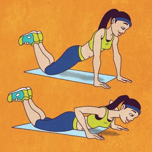 a woman doing planks on her stomach with the help of a dumbble belt