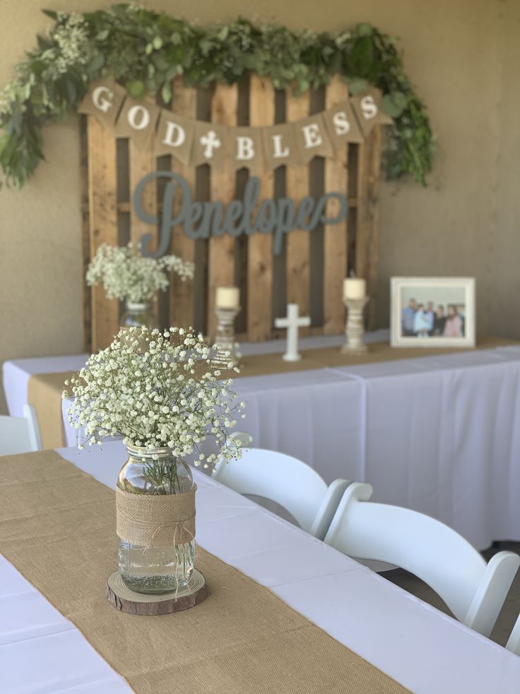 a vase filled with baby's breath sitting on top of a table