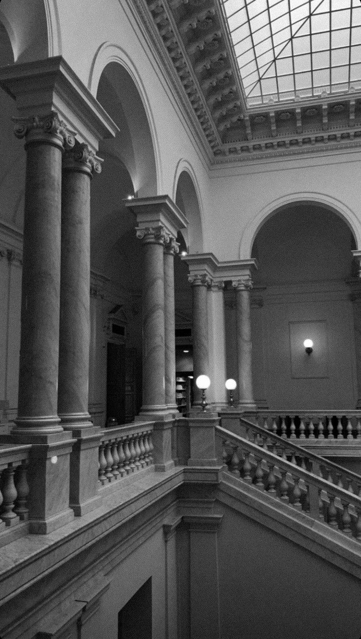 the interior of a large building with many pillars