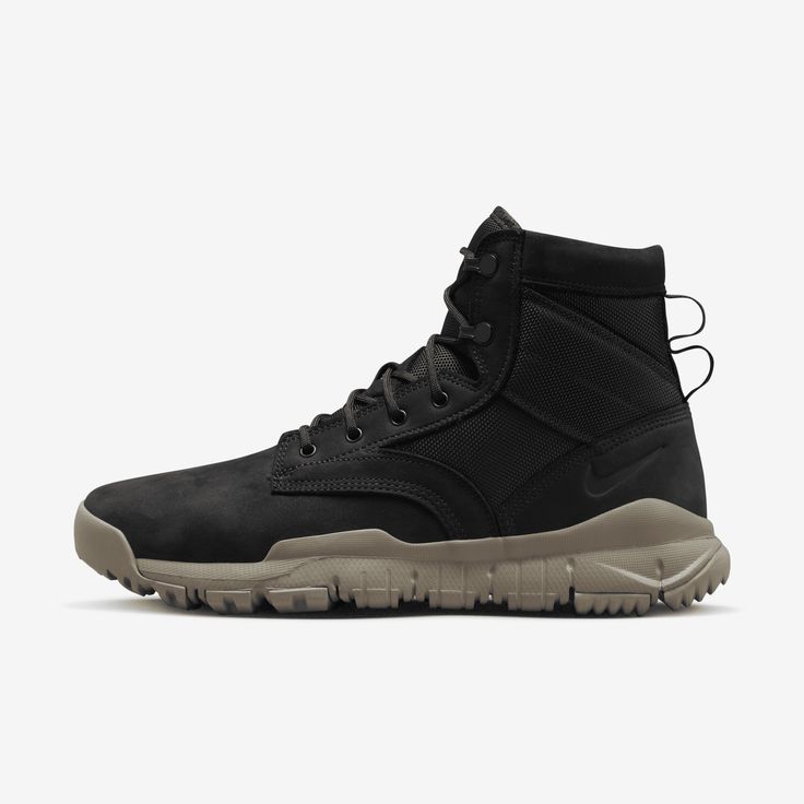 The Nike SFB 6" Leather Men's Boot brings the Special Field Boot to Nike Sportswear for the first time as a SneakerBoot, complete with weather-resistant leather and a rugged traction pattern. Nike Lace-up Hiking Boots For Outdoor Work, Black Abrasion-resistant Waterproof Boots For Sports, Tactical Waterproof Hiking Boots, Urban Black Leather Combat Boots, Black Leather Urban Combat Boots, Nike Sports Boots With Reinforced Toe, Nike Boots With Reinforced Toe For Sports, Black Abrasion-resistant Hiking Boots For Outdoor Activities, Nike Black Hiking Boots With Round Toe