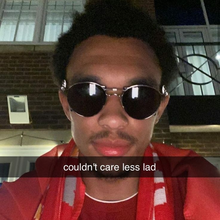 a man wearing sunglasses and a red hoodie with the words just won the league i don't give a fluck what u think la