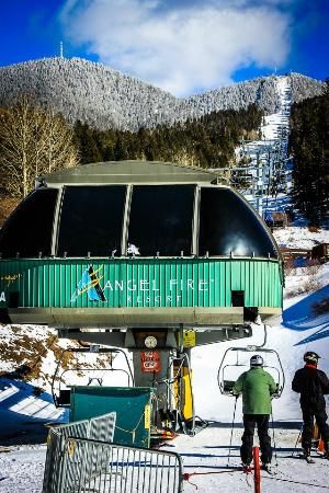 skiers at the bottom of a ski lift