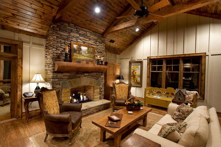 a living room filled with furniture and a fire place