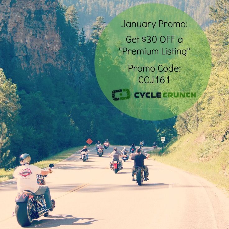 a group of people riding motorcycles down a road in front of some mountains and trees