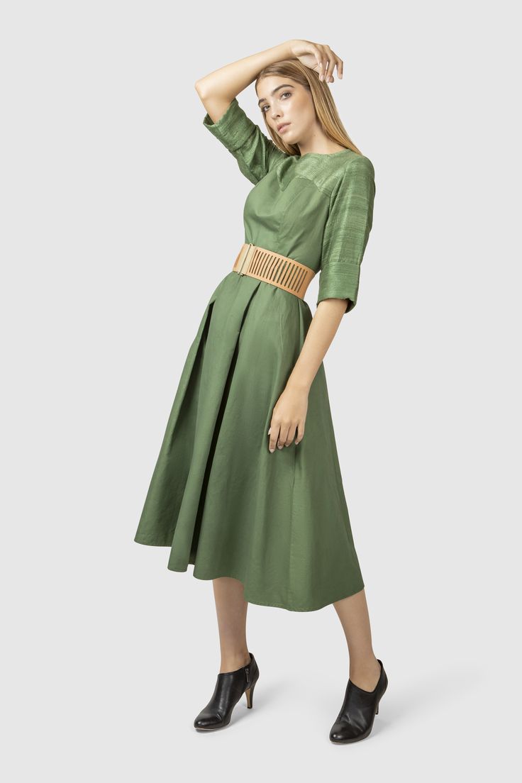 Influenced by the endless expanse of forest and the mind clouded by color green, this fit and flare dress is tailored in a beautiful green tone.   Fabric: Shell: 100% wool, hand weaved in India Lining: 100% cotton Green Silk A-line Midi Dress, Green Flared Skirt Dress For Spring, Green Midi Dress With Pleated Bodice, Chic Green A-line Pleated Dress, Green Pleated Skirt Evening Dress, Green Silk Dress With Pleated Bodice, Green Pleated Flared Dress, Green Pleated Flared Skirt Dress, Green Flared Pleated Dress