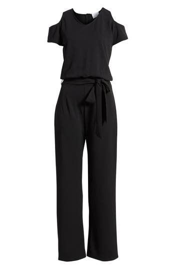 Cutouts at the shoulders add a modern touch to this comfortable stretch-enriched jumpsuit tethered at the waist by a sash. Scoop neck Cold-shoulder short sleeves Removable sash 90% polyester, 10% spandex Dry clean Made in the USA Chic Strapless Jumpsuit With Tie Waist, Belted Strapless Jumpsuit For Workwear, Chic Belted Strapless Jumpsuit For Work, Chic Jumpsuits With Tie Waist For Night Out, Black Tie Waist Jumpsuit For Work, Casual Belted Jumpsuits And Rompers For Night Out, Chic Black Jumpsuit With Tie Waist, Elegant Jumpsuits And Rompers With Tie Waist, Black Casual Strapless Jumpsuit For Work