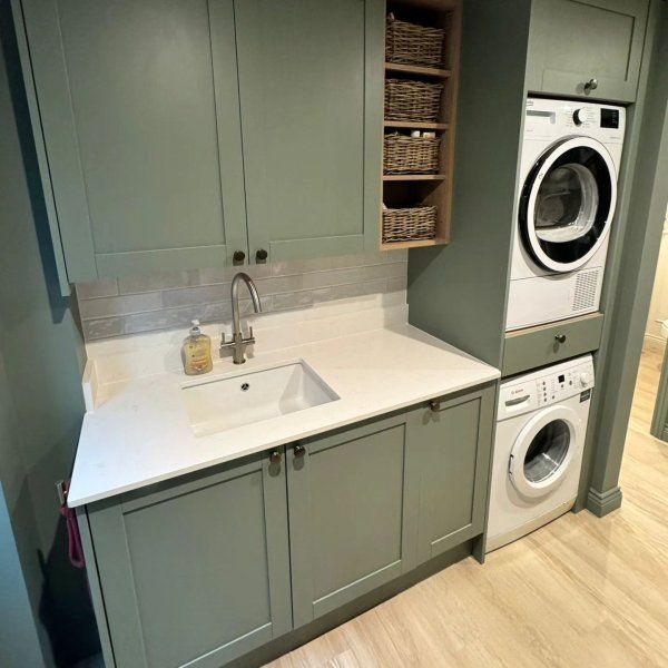 a laundry room with washer and dryer in it