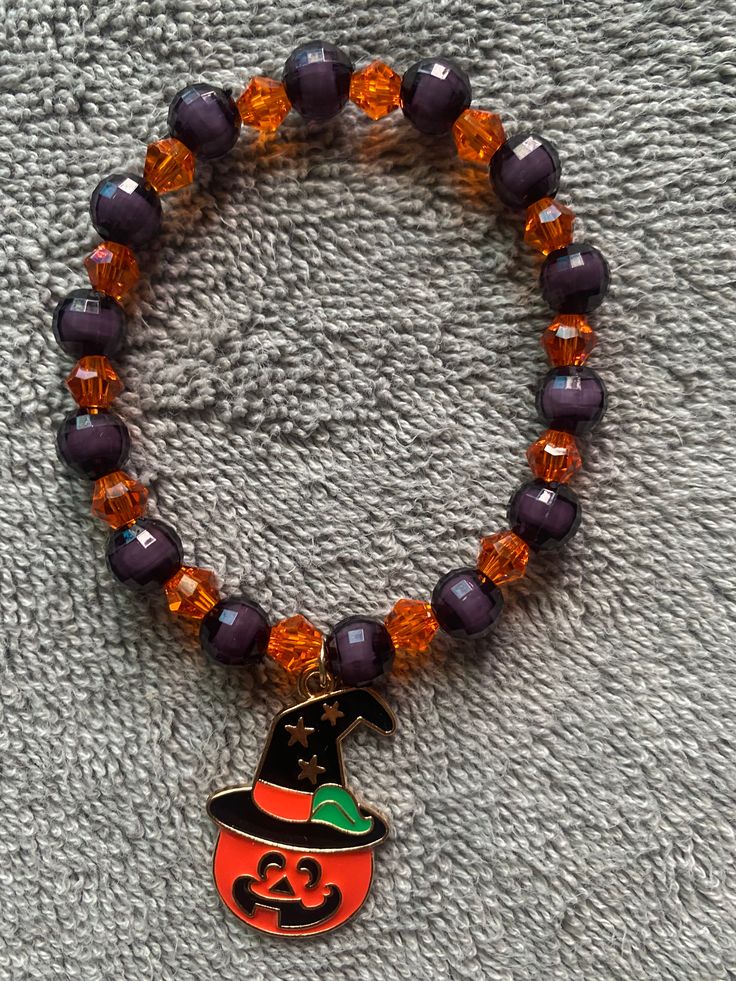 Halloween Bracelet Complete your Halloween look with a stylish black and orange beaded bracelet, adorned with dangling Halloween charms. This sleek and shiny accessory is the perfect piece to suit any Halloween costume, adding a touch of sparkle to your night. Material: White String Color: Black and orange shiny beads with Halloween charms Gender: Unisex Type: Bracelet Style: Holiday Season l Osuna’s Jewelry Halloween Novelty Beaded Bracelets With Round Beads, Halloween Novelty Bracelet With Round Beads, Beaded Bracelets For Halloween Gift, Handmade Orange Beaded Bracelets For Party, Halloween Black Charm Bracelet, Adjustable Black Beaded Bracelets For Halloween, Party Novelty Beaded Bracelets, Orange Beaded Bracelets For Party, Halloween Beaded Bracelets For Party