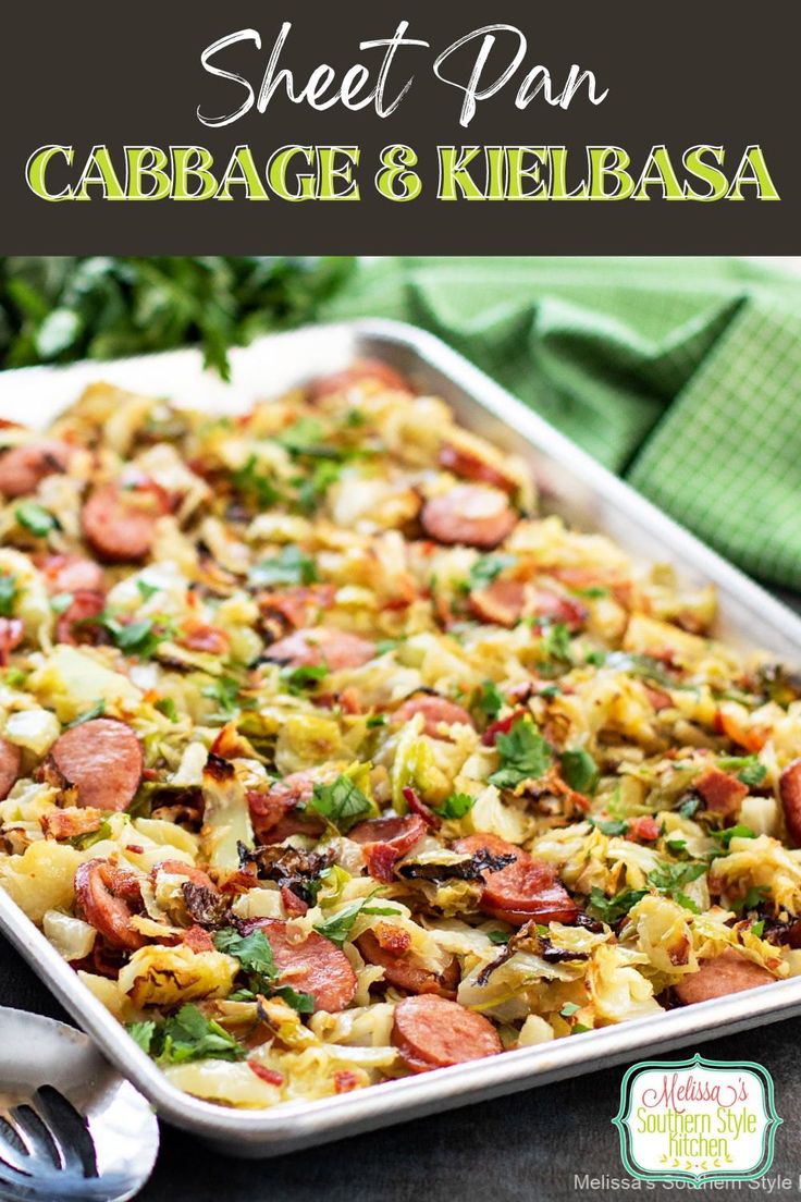 a sheet pan filled with sausage and kielbasa casserole on top of a table