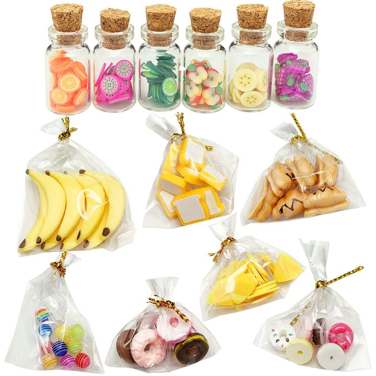 six clear bags filled with different types of fruit and snacks in each bag, including bananas, pineapples, apples, kiwi's, strawberries, donuts, cookies, and more