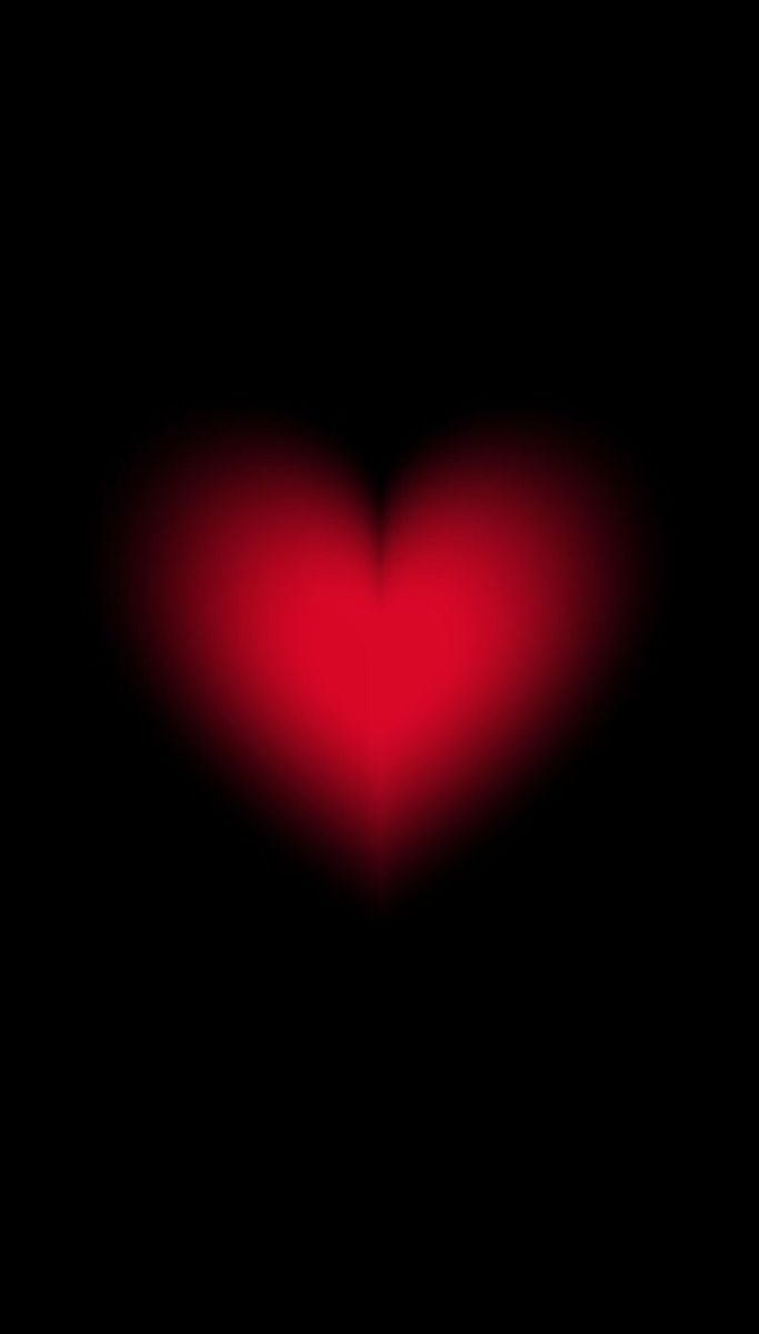 a red heart on a black background